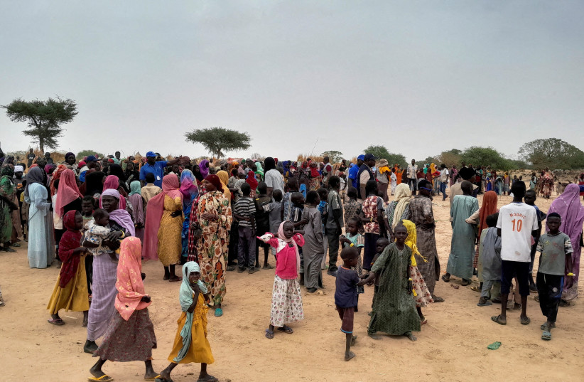  Sudanese people, who fled the violence in their country and newly arrived, wait to be registered at the camp near the border between Sudan and Chad in Adre, Chad April 26, 2023.  (photo credit: REUTERS/Mahamat Ramadane//File Photo)