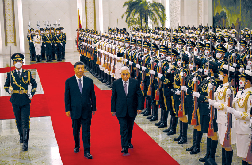  China’s President Xi Jinping and PA President Mahmoud Abbas attend a welcoming ceremony at the Great Hall of the People in Beijing, June 14.  (photo credit: JADE GAO/POOL/REUTERS)