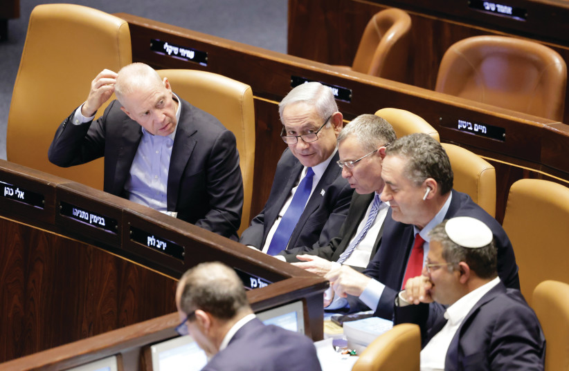  MEMBERS OF Prime Minister Benjamin Netanyahu’s ruling coalition get ready to vote for the reasonableness bill on Monday night in the Knesset.  (photo credit: MARC ISRAEL SELLEM/THE JERUSALEM POST)