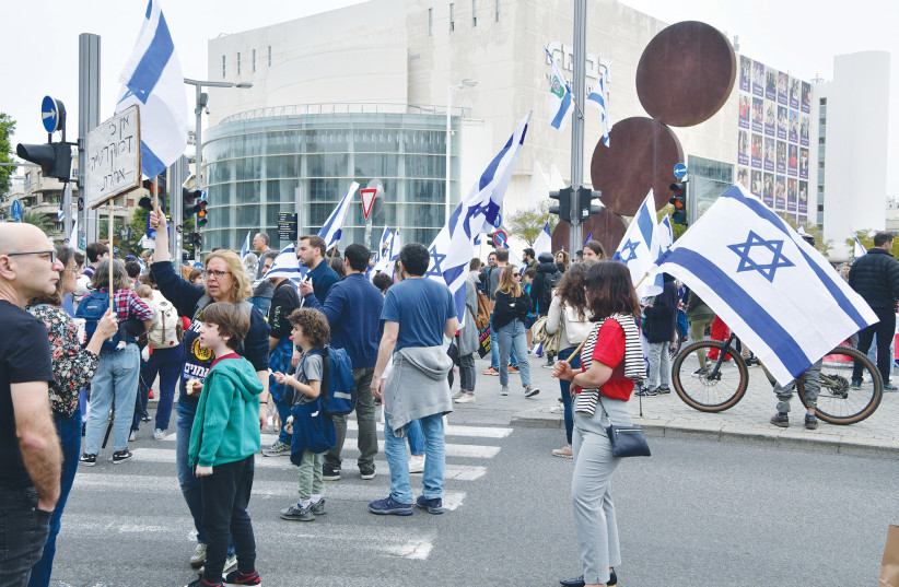  PARENTS AND their children protest against the government’s planned judicial overhaul, in Tel Aviv, in March. (photo credit: AVSHALOM SASSONI/FLASH90)