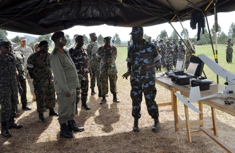  Ugandan President Yoweri Kaguta Museveni (left) listens (photo credit: PICRYL)