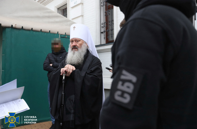 Members of the State Security Service of Ukraine read an accusation letter to abbot of the Kyiv Pechersk Lavra Metropolitan Pavlo of the Ukrainian Orthodox Church, accused of being linked to Moscow, amid Russia's attack on Ukraine, at a compound of the monastery in Kyiv, Ukraine April 1, 2023. (photo credit: Press service of State Security Service of Ukraine/Handout via REUTERS)
