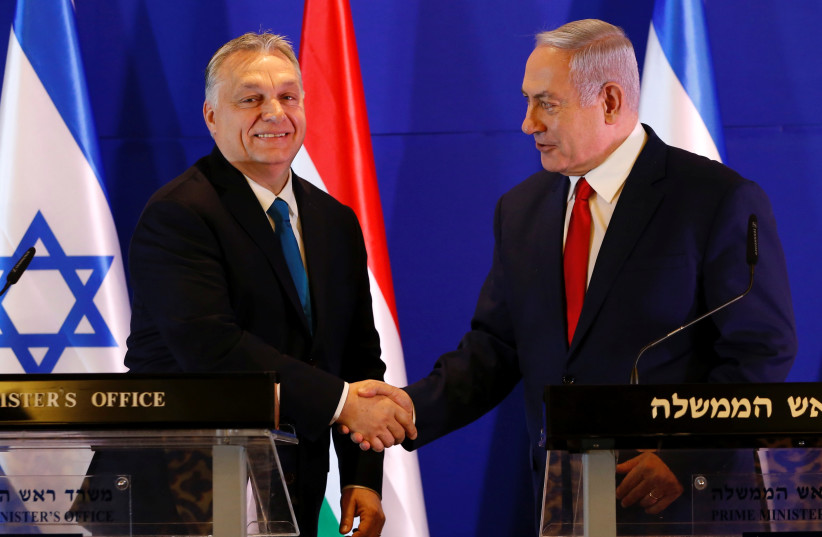  Hungarian Prime Minister Viktor Orban and Israeli Prime Minister Benjamin Netanyahu shake hands after their meeting in Jerusalem February 19, 2019. (photo credit: ARIEL SCHALIT/POOL VIA REUTERS)
