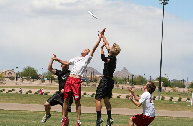  An illustrative image of people playing Ultimate Frisbee. (photo credit: Wikimedia Commons)