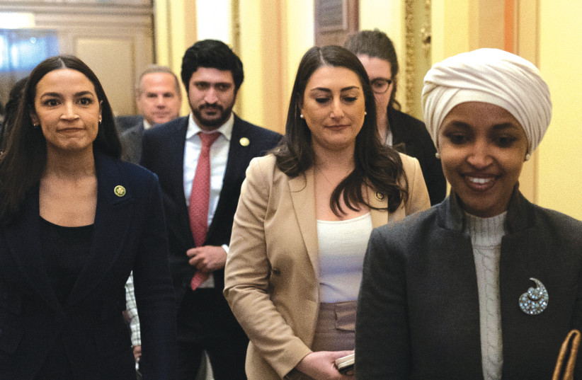  US REP. Alexandria Ocasio-Cortez glances from behind (left) at Rep. Ilhan Omar, after Omar was ousted by the Republican-led House of Representatives from serving on the Foreign Affairs Committee, earlier this year. (photo credit: TOM BRENNER/REUTERS)