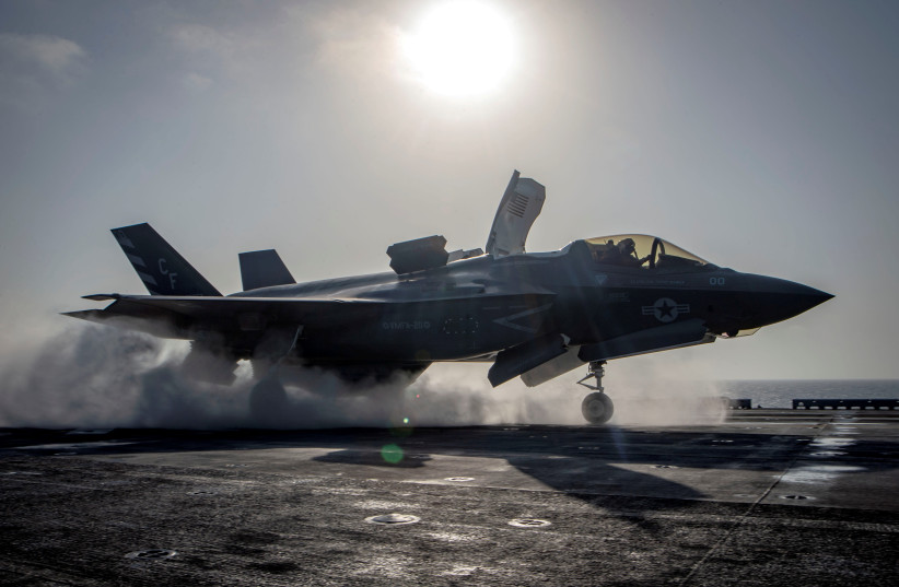  A F-35B Lightning II aircraft from the Marine Fighter Attack Squadron 211 launches from the deck aboard the amphibious assault ship USS Essex as part of the F-35B's first combat strike, against a Taliban target in Afghanistan, September 27, 2018. (photo credit: Mass Communication Specialist 3rd Class Matthew Freeman/US Navy/Handout via REUTERS)