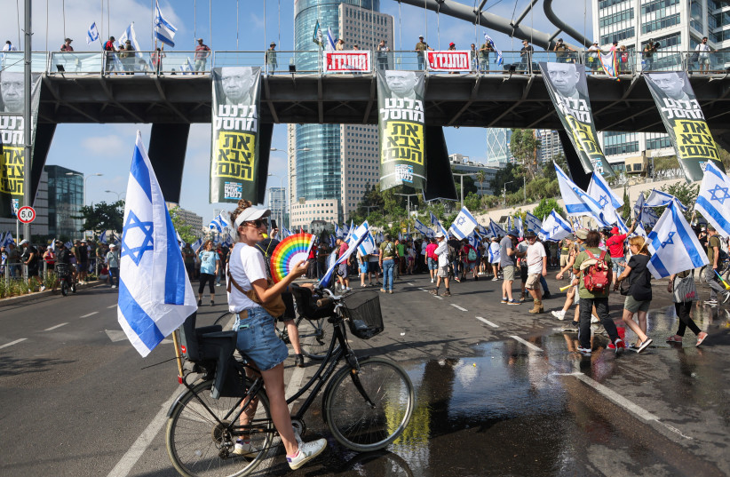  People demonstrate on the 'Day of National Resistance' in protest against Israeli Prime Minister Benjamin Netanyahu and his nationalist coalition government's judicial reform, in Tel Aviv, Israel July 18, 2023. (photo credit: NIR ELIAS / REUTERS)