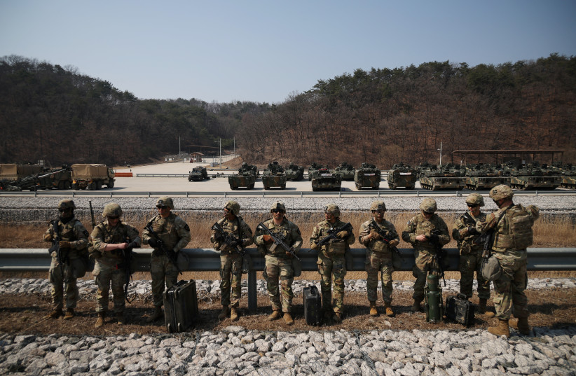  US soldiers take part in a military exercise which is a part of the Freedom Shield joint military exercise between South Korea and US, at a training field near the demilitarized zone separating the two Koreas in Pocheon, South Korea, March 19, 2023. (photo credit: REUTERS/KIM HONG-JI)
