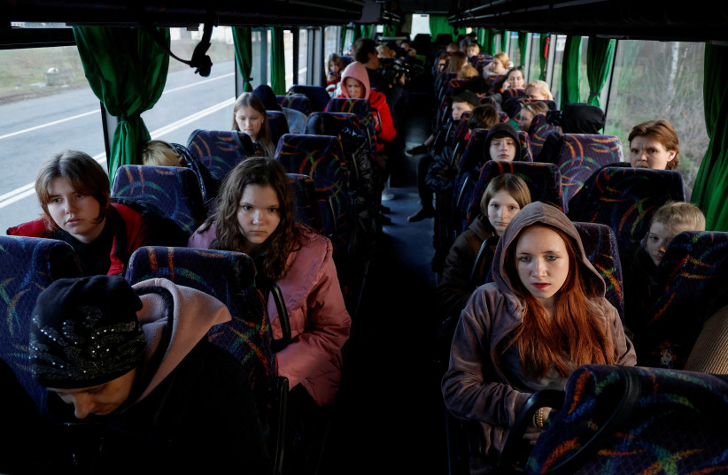  Children taken to Russia wait for departure to Kyiv after returning via the Ukraine-Belarus border in Volyn region (photo credit: REUTERS)
