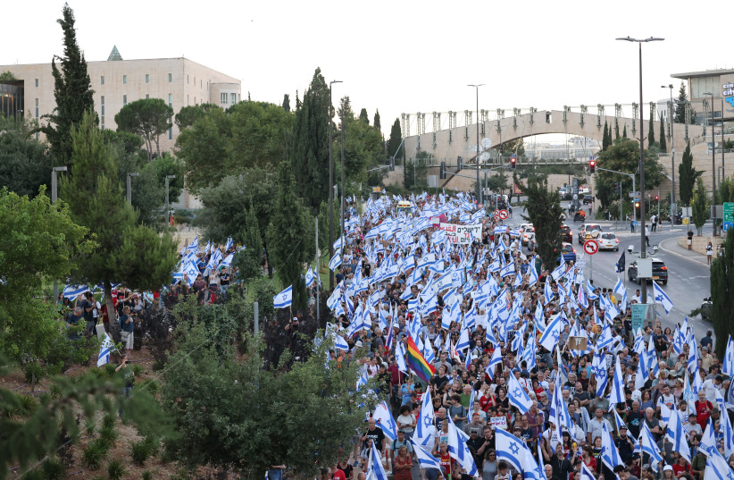  Israelis protest against the government's planned judicial overhaul, outside the Supreme Court in Jerusalem on July 18, 2023.  (photo credit: YONATAN SINDEL/FLASH90)