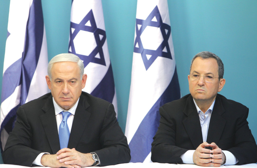  PRIME MINISTER Benjamin Netanyahu and then-defense minister Ehud Barak attend a news conference at the Prime Minister’s Office in Jerusalem, in 2012 (photo credit: MIRIAM ALSTER/FLASH90)