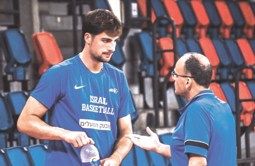  DENI AVDIJA (left) talks with Israel head coach Ariel Beit Halachmi this week during the opening practice for the National Team at Tel Aviv’s Drive-In Arena. (photo credit: YEHUDA HALICKMAN)