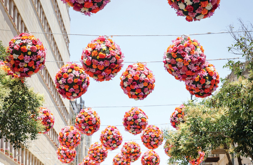  TEN MEASURES of beauty: Flowers decorate a normally bustling city center street.  (photo credit: NATI SHOHAT/FLASH90)
