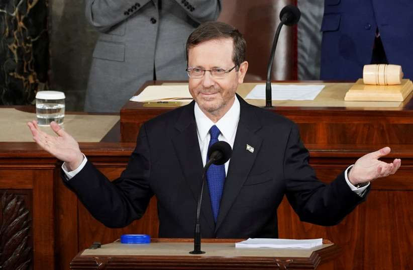  Israeli President Isaac Herzog reacts prior to address to a joint meeting of Congress in the House Chamber of the U.S. Capitol in Washington, U.S., July 19, 2023. (photo credit: REUTERS/KEVIN LAMARQUE)