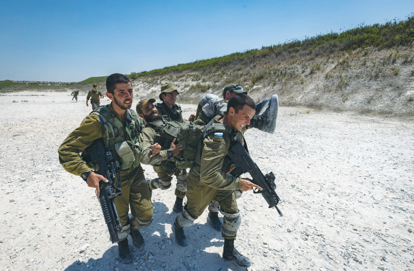  GOLANI SOLDIERS take part in a training exercise, 2021. This week, hundreds of Golani reservists have been participating in a massive training exercise, and not a single reserve soldier refused to show-up for duty, according to their commander (photo credit: OLIVIER FITOUSSI/FLASH90)