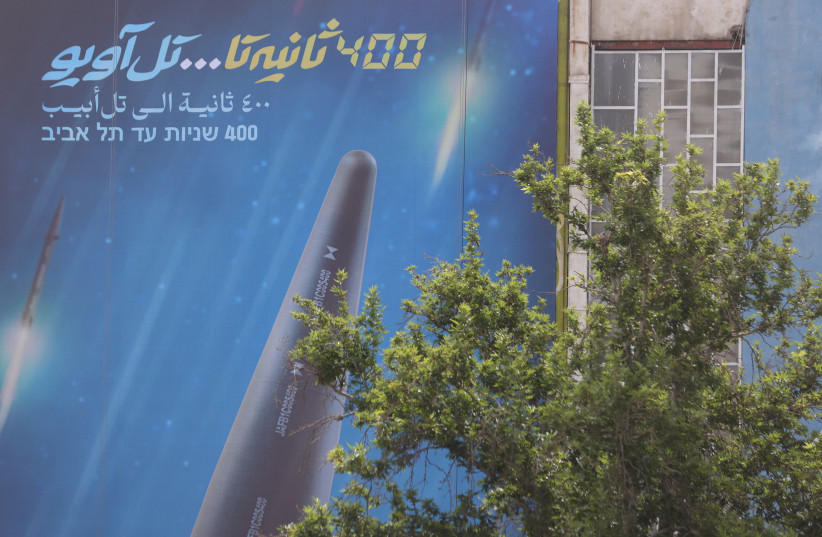  A billboard with a photo of a new hypersonic ballistic missile called "Fattah" and with text reading "400 seconds to Tel Aviv" is seen on a building in Tehran, Iran June 8, 2023 (photo credit: MAJID ASGARIPOUR/WANA (WEST ASIA NEWS AGENCY) VIA REUTERS)