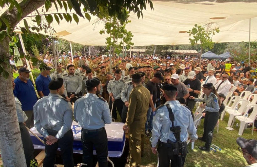  Forces gathered at the funeral of a fallen soldier. (photo credit: AVSHALOM SASSONI/MAARIV)