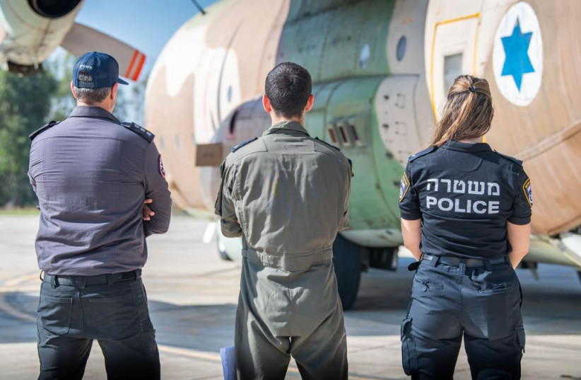  Israel Police officers and rescue personnel are seen in Greece preparing to carry out an emergency aid mission fighting the forest fires raging in northern Athens on July 21, 2023.  (photo credit: ISRAEL POLICE SPOKESPERSON'S UNIT)