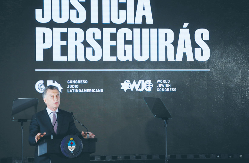  THEN-ARGENTINIAN PRESIDENT Mauricio Macri speaks at an event in Buenos Aires in memory of the victims of the 1994 bombing at the AMIA community center, marking the 25th anniversary of the attack, in 2019.  (photo credit: AGUSTIN MARCARIAN/REUTERS)