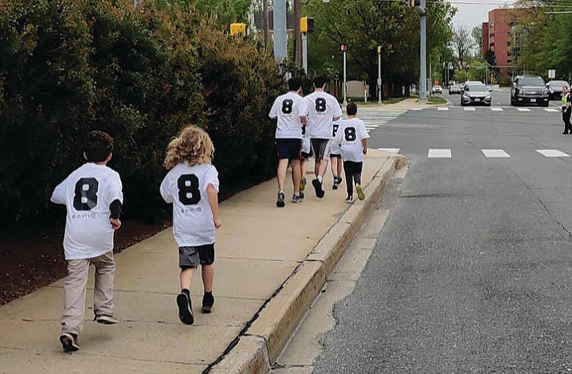  SHAKED AND EITAN, first grade Scouts from the Greater DC Tzofim Scouts, run in memory of Gilad Misheiker.  (photo credit: Yehonatan Vaisband, the Greater DC Tzofim Scouts Head of Media)