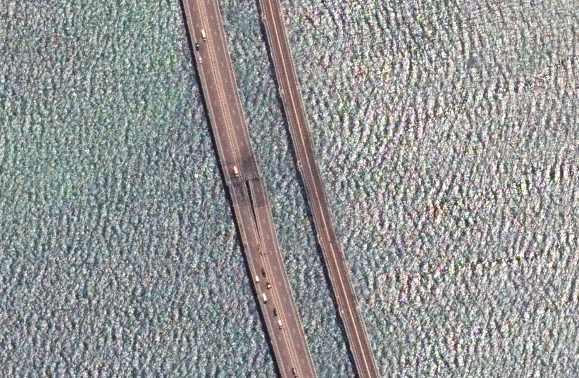 A satellite image shows a rotated and close up view of the damaged span of the Crimea bridge in Kerch Strait, July 17,2023. (photo credit: MAXAR TECHNOLOGY/HANDOUT VIA REUTERS)