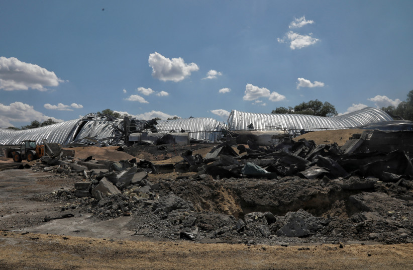 A view shows a grain warehouse destroyed by a Russian missile strike, amid Russia's attack on Ukraine, at a compound of an agricultural company in the village of Pavlivka, in Odesa region, Ukraine July 21, 2023. (photo credit: REUTERS/Nina Liashonok)