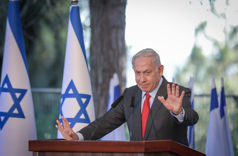  Israeli Prime Minister Benjamin Netanyahu is seen speaking at a memorial ceremony for Ze'ev Jabotinsky on Mount Herzl, in Jerusalem, on July 18, 2023. (photo credit: NOAM REVKIN FENTON/FLASH90)