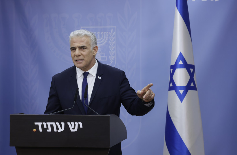  Opposition leader Yair Lapid addresses the press after the reasonableness standard passes into law. (photo credit: MARC ISRAEL SELLEM)