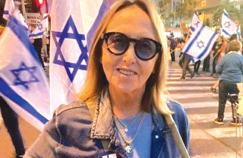  SHELLEY GOLDMAN protests at Kaplan Street in Tel Aviv. Her sticker reads: ‘Loyal to the Declaration of Independence.’ (photo credit: Shelley Goldman)