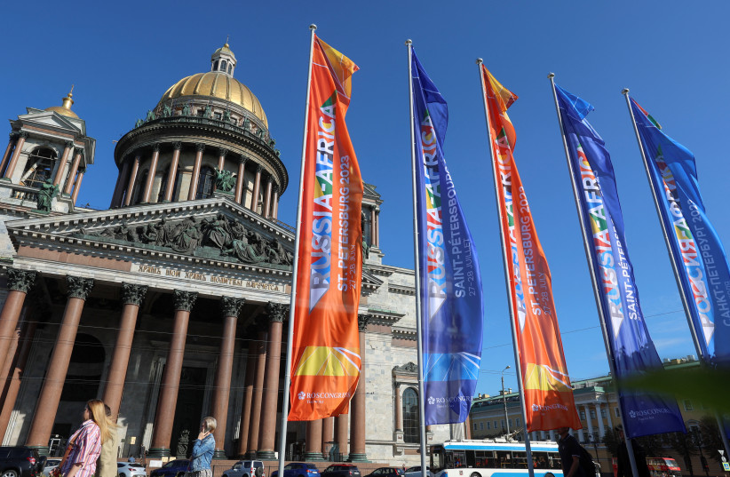 Flags informing of the upcoming Russia-Africa summit fly in front of Saint Isaac's Cathedral in central Saint Petersburg, Russia, July 25, 2023. (photo credit: ANTON VAGANOV/ REUTERS)