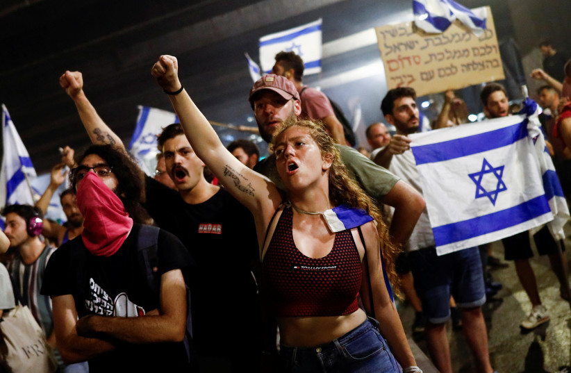  Protesters block Ayalon Highway during a demonstration following a parliament vote on a contested bill that limits Supreme Court powers to void some government decisions, in Tel Aviv, Israel July 25, 2023 (photo credit: CORINNA KERN/REUTERS)