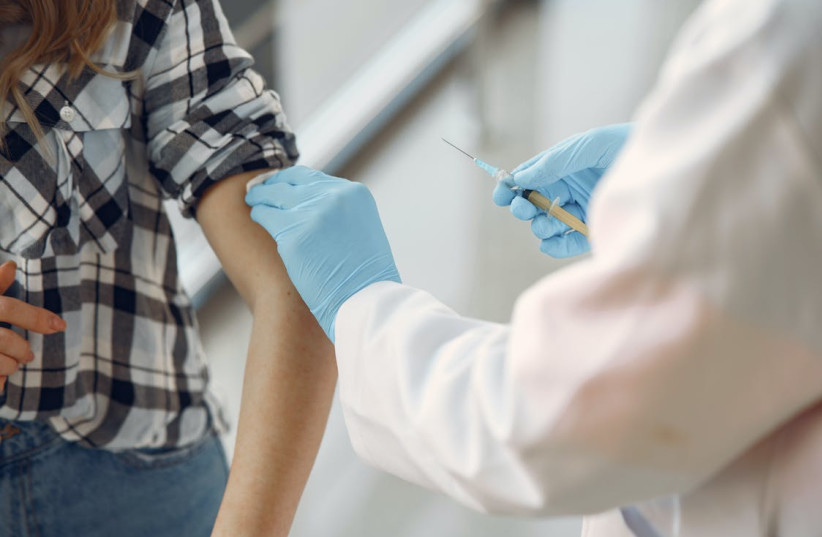  Person getting vaccinated. (photo credit: PEXELS)