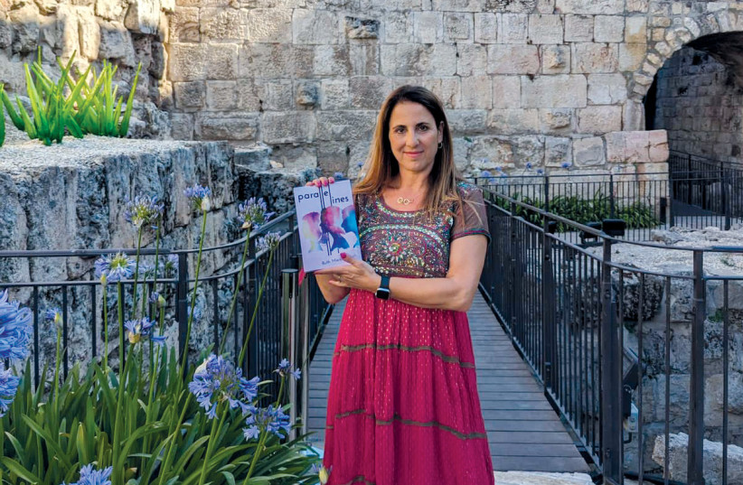  Ruth Marks Eglash holding her new book at the Tower of David Museum. (photo credit: MIRIAM ABRAMOWITZ SHAVIV)