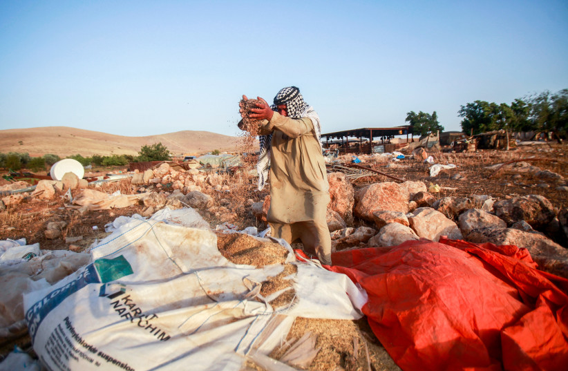  A man stands near a structure that was demolished by Israeli authorities, at the Bedouin village of Khirbet al-Hamidiyeh, in the northern Jordan Valley, on June 17, 2023 (photo credit: NASSER ISHTAYEH/FLASH90)
