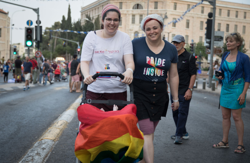 People take part in the annual LGBTQ Pride Parade in Jerusalem, on June 6, 2019.  (photo credit: NOAM REVKIN FENTON/FLASH90)