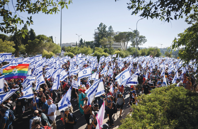  ANTI-JUDICIAL REFORM activists march in Jerusalem, at the beginning of the week. (photo credit: Chaim Goldberg/Flash90)