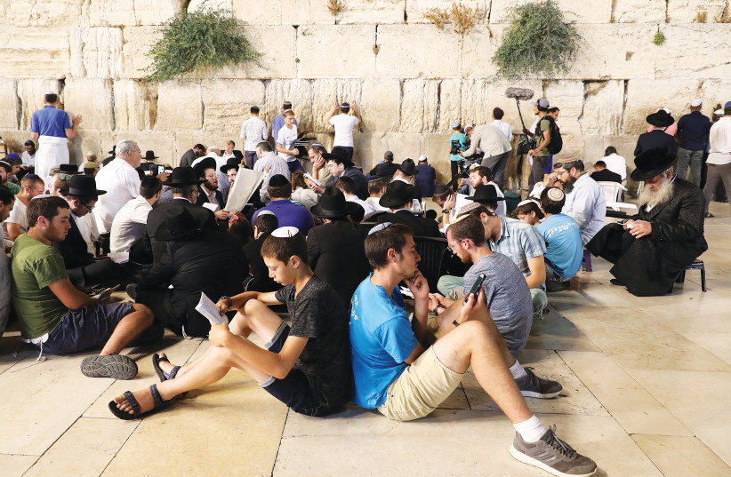  TISHA BE’AV observed at the Western Wall. (photo credit: MARC ISRAEL SELLEM/THE JERUSALEM POST)