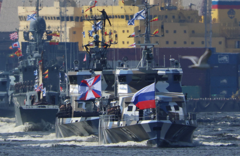  Russian warships sail as they take part in a rehearsal for the Navy Day parade in Saint Petersburg, Russia July 19, 2023 (photo credit: REUTERS/ANTON VAGANOV)