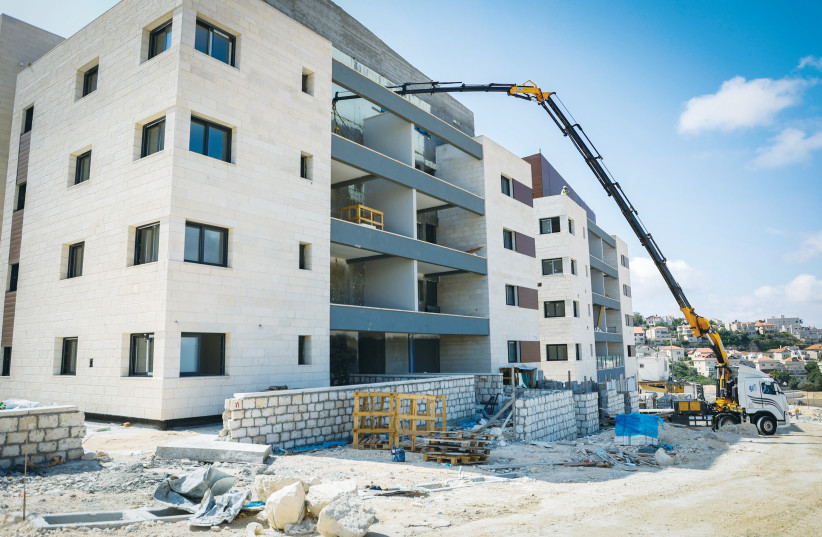  CONSTRUCTION OF new housing takes place at Neve Daniel, in Gush Etzion, last month. As the indigenous people of the land, with a 3,000-year continuous presence in the land, the Jewish people have the strongest claim to the land, the writer asserts.  (photo credit: GERSHON ELINSON/FLASH90)