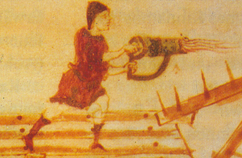  Use of a hand-siphon, a portable flame-thrower, from a siege tower. Detail from the medieval manuscript Codex Vaticanus Graecus 1605. (photo credit: Wikimedia Commons)