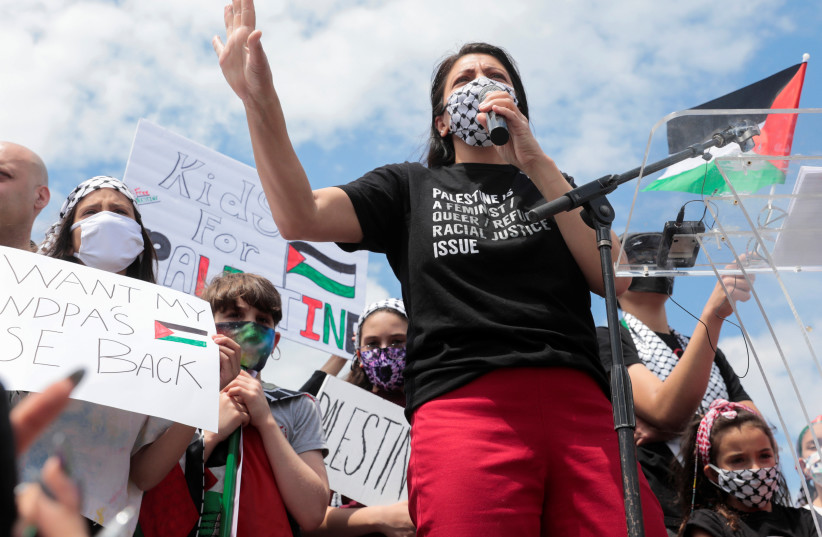  Palestinian-American congresswoman Rashida Tlaib attends a pro-Palestinian protest in Dearborn, Michigan, U.S., May 16, 2021. (photo credit: REUTERS/REBECCA COOK)