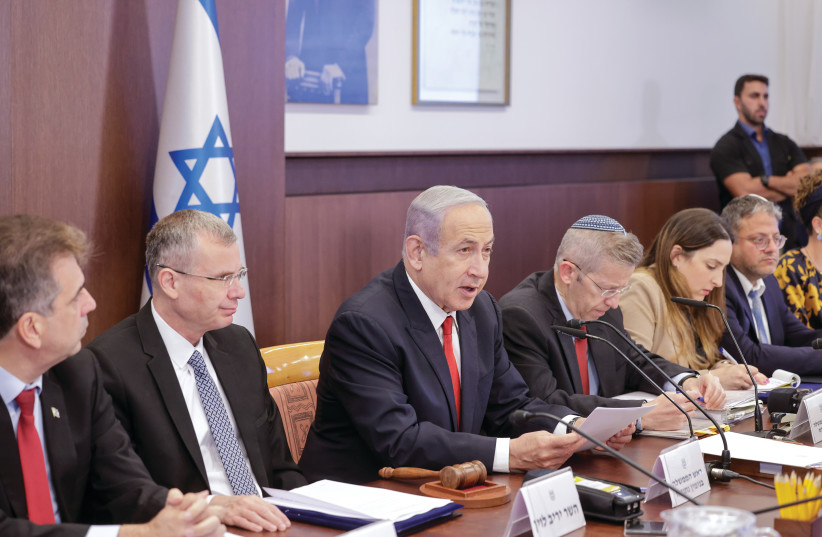  PRIME MINISTER Benjamin Netanyahu addresses his cabinet. The actions of Netanyahu’s coalition threaten not only Israel’s democracy, economy, and social cohesion but also its long-term security, the writers maintain. (photo credit: MARC ISRAEL SELLEM/THE JERUSALEM POST)
