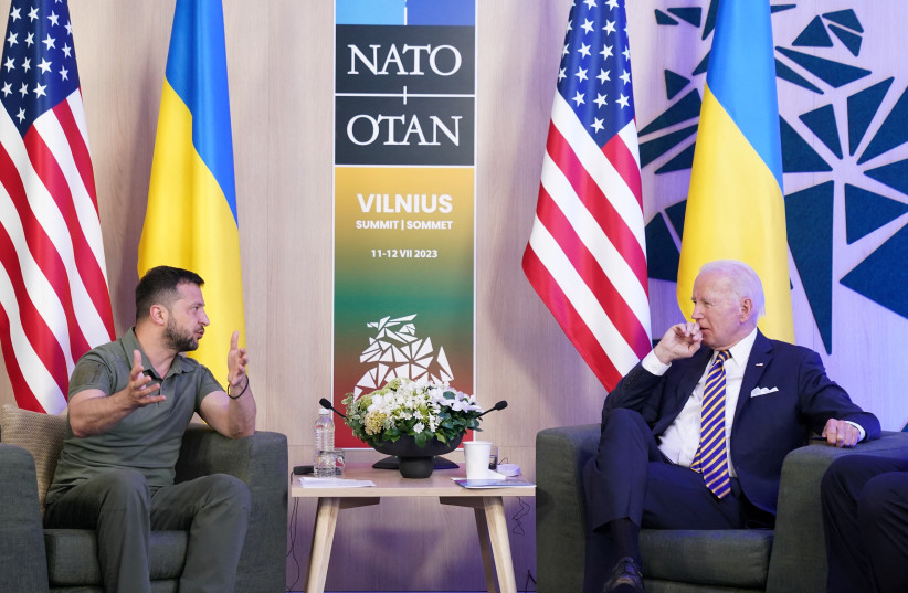  Ukraine's President Volodymyr Zelensky and US President Joe Biden attend a bilateral meeting, as the NATO summit is held in Vilnius, Lithuania, July 12, 2023. (photo credit: REUTERS/KEVIN LAMARQUE)