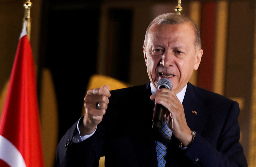  Turkish President Tayyip Erdogan addresses supporters at the Presidential Palace after his victory in the second round of the presidential election, Ankara, Turkey, May 29, 2023. (photo credit: REUTERS/UMIT BEKTAS)