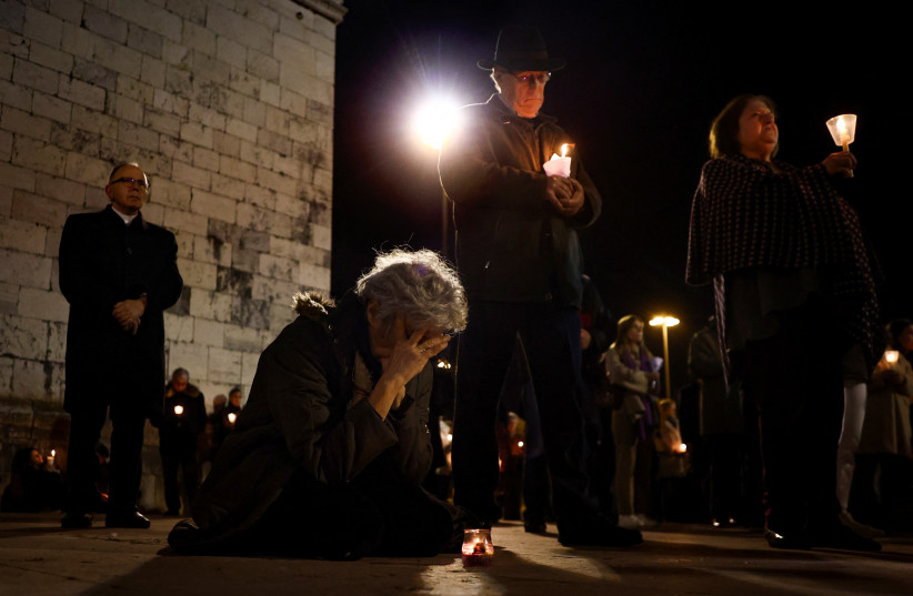  People participate in a vigil in support of the 4,815 children that were sexually abused by members of the Portuguese Catholic Church, according to the commission investigating the issue, in Lisbon, Portugal, February 22, 2023. (photo credit: REUTERS/PEDRO NUNES)