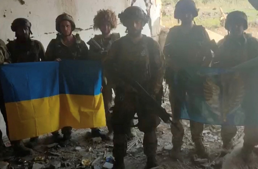  Ukrainian soldiers say they have recaptured the Ukrainian village of Staromaiorske, in Donetsk region, Ukraine, in this screen grab from video posted by Ukrainian President Volodymyr Zelensky and released on July 27, 2023. (photo credit: Telegram/V_Zelenskiy_official/via REUTERS)