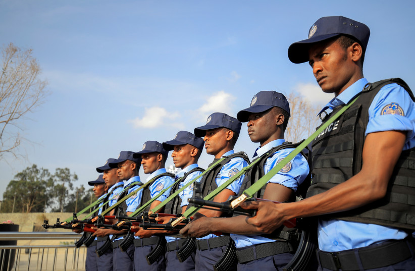  Addis Ababa police officers, take part in a parade displaying their new uniforms, and their readiness for the upcoming Ethiopian parliamentary and regional elections in Addis Ababa, Ethiopia, June 19, 2021. (photo credit: Tiksa Negeri/Reuters)