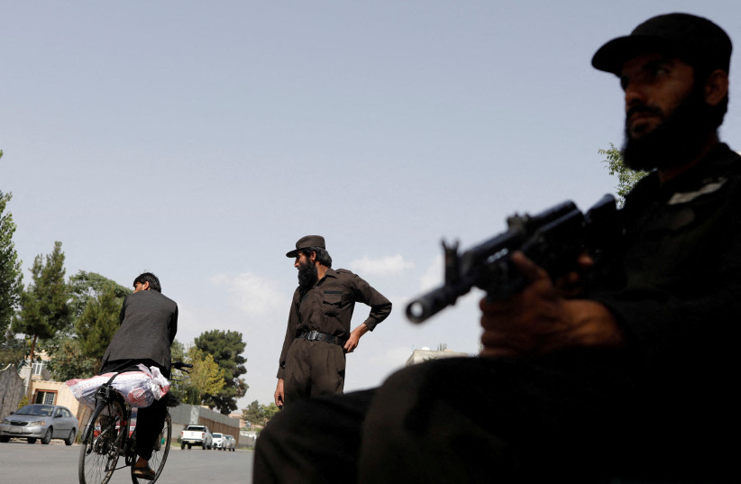  Taliban soldiers stand guard at a checkpoint in Kabul, Afghanistan, July 6, 2023. (photo credit:  REUTERS/ALI KHARA)