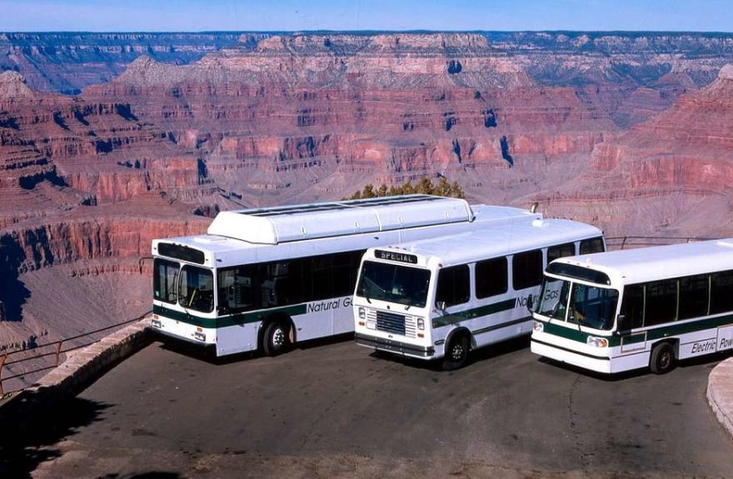 Three buses parked on a ledge overlooking the Grand Canyon in Arizona, US. (photo credit: PICRYL)