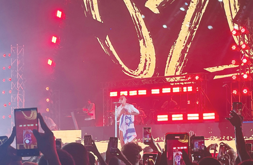  OZUNA WAVED and even draped himself in an Israeli flag toward the end of the show (photo credit: SHANNA FULD)